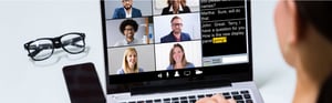 Teleconference Captioned Meeting with Captions in use, with all people in the meeting smiling and speaking freely